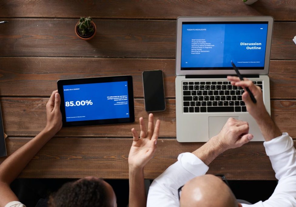 photo-of-people-near-wooden-table-3183156